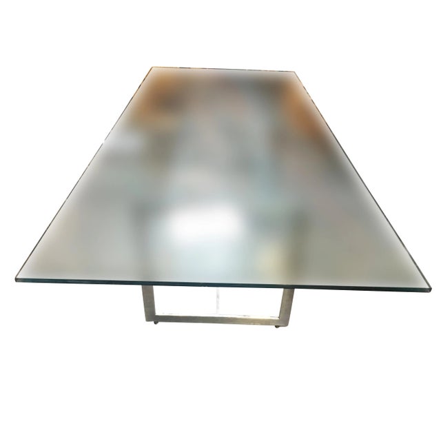 Large 8-person glass dining room table with a sculptural chrome base by Milo Baughman. Milo Baughman was a renowned...