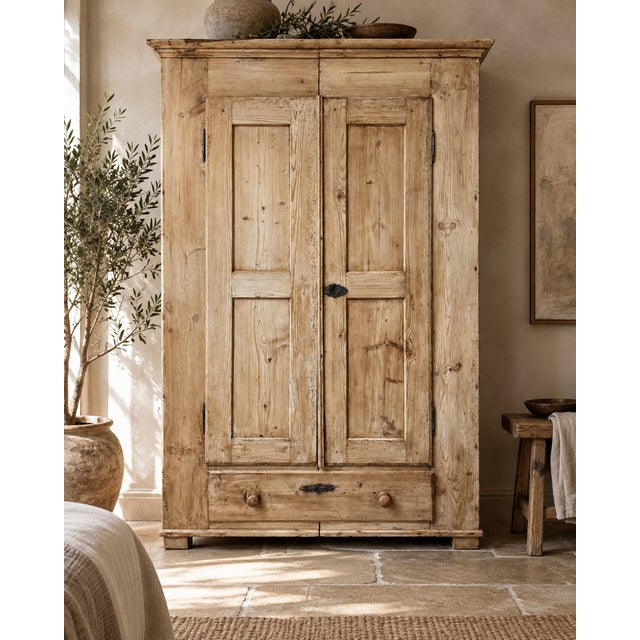 A handsome late 19th century pine wardrobe with a wonderfully honest, timeworn surface and practical knock-down...