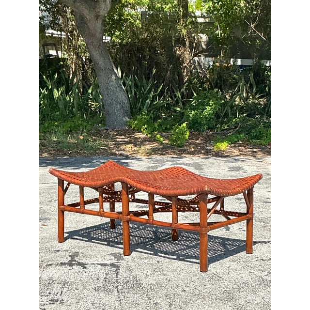 Channel iconic McGuire style with this vintage coastal bench, featuring a striking rattan frame and an intricately woven...
