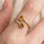 Citrine Open Band Ring This elegant ring highlights the radiant beauty of citrine gemstones, celebrated for their warm...