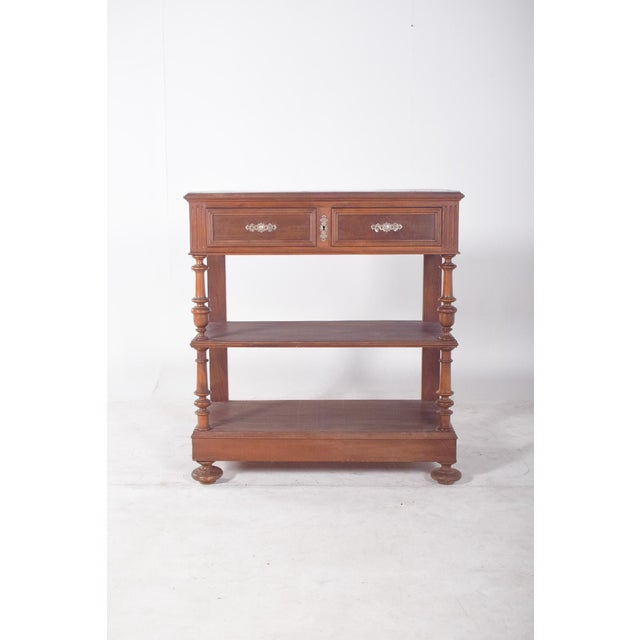 Henry II style carving cabinet. The upper body is made up of two symmetrical drawers with framed friezes and decorated...