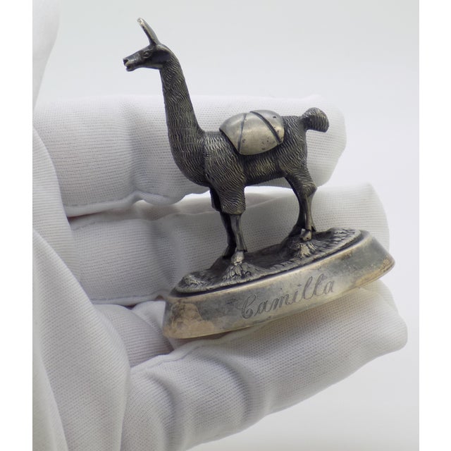 This sterling silver miniature depicts a classic Peruvian llama, capturing the traditional animalier heritage of South...