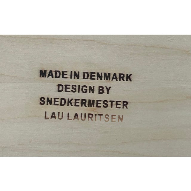 The legs are crafted from birch plywood, while the tabletop is made of plywood with an exotic wood veneer.