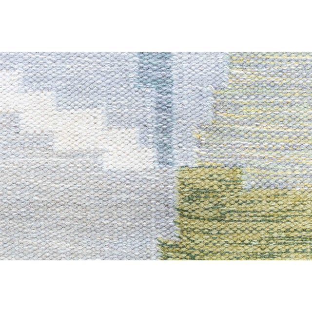 This 1950s Swedish Flat-Weave Rug by Ingegerd Silow embodies the celebrated mid-century Scandinavian aesthetic with its...