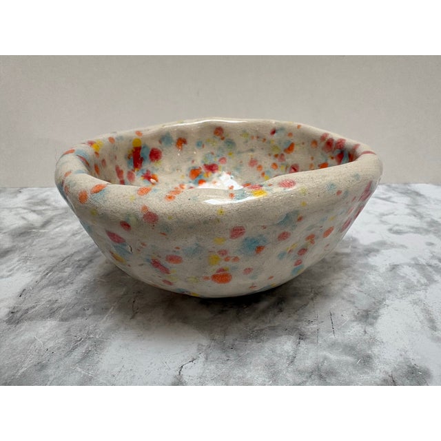 Vintage petite studio pottery trinket bowl or decor accent. Speckle colorful dotty pattern and glossy glaze. Whimsical and...