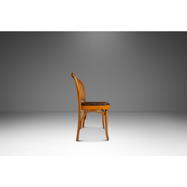 Introducing a rare and beautiful single bentwood Prague Model 811 side chair by or after the renowned designers Josef...