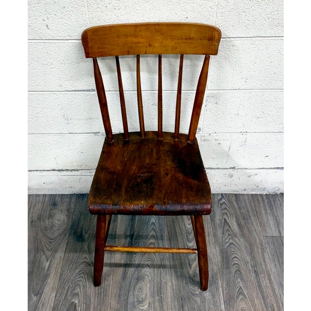 This is a gorgeous antique American Windsor farmhouse style plank seat dining chair, likely from the early 19th century,...