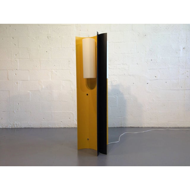 Very interesting floor lamp, three painted metal semicircles connected to each other and three round plastic shades. Floor...