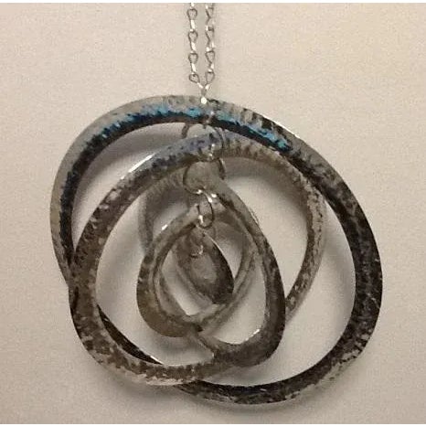 Enjoy the sensory delights of this marvelous metal mobile/hanging sculpture Five concentric circles in decreasing sizes...