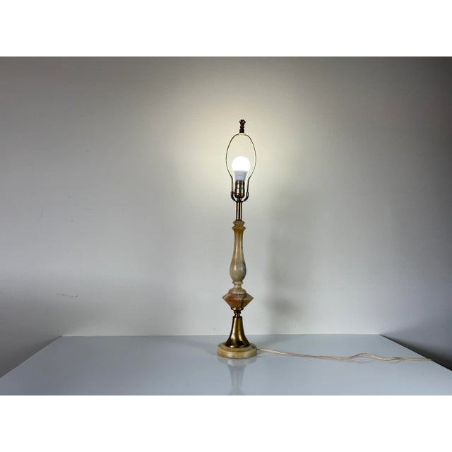 A beautiful Vintage hand-carved Italian alabaster and brass detailing table lamp. Made of high quality alabaster....