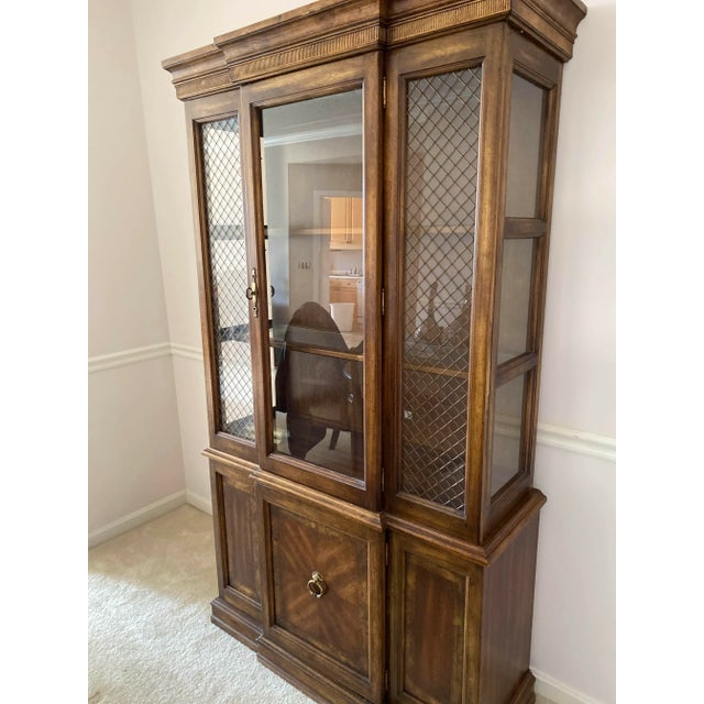 This china hutch is the perfect addition to any dining room set. It features a provincial look with medium brown stain to...