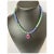 Unique and colorful macrame necklace with oval synthetic pink sapphire pendant. The large vibrant pink stone is set in...