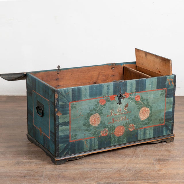 Original blue painted dome top trunk from Sweden with traditional hand-painted details include floral motif along top and...