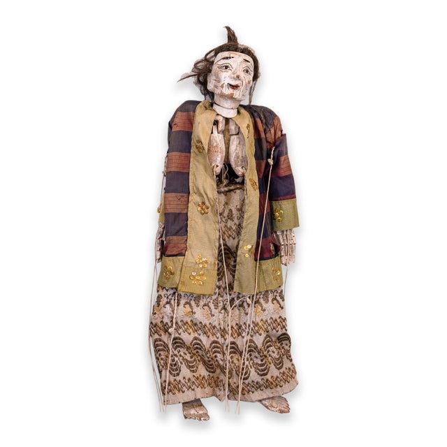 An antique pair of Burmese / Thailand marionette puppet dolls depicting a man and woman wearing traditional Thai silk and...