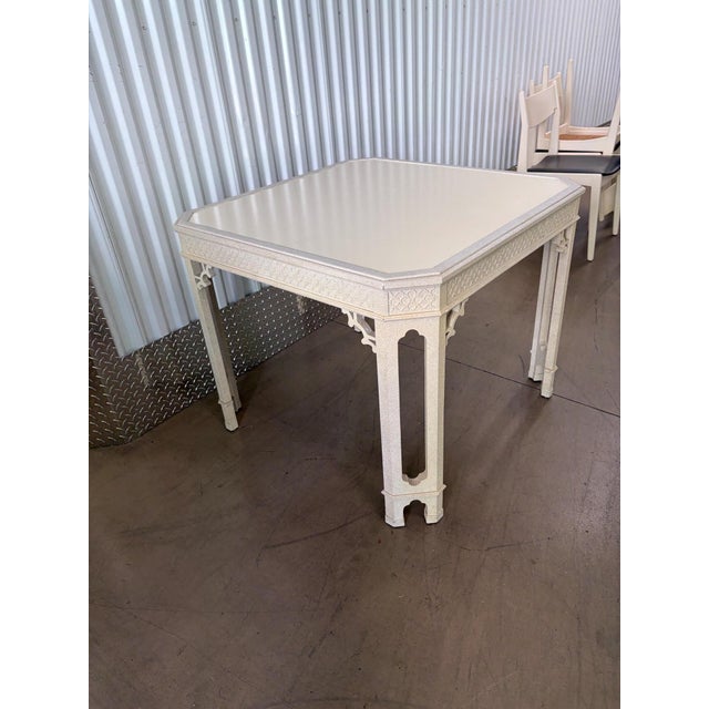 I cannot find this particular game table. It features border and corner fretwork. The legs have Moroccan cuts. The top is...