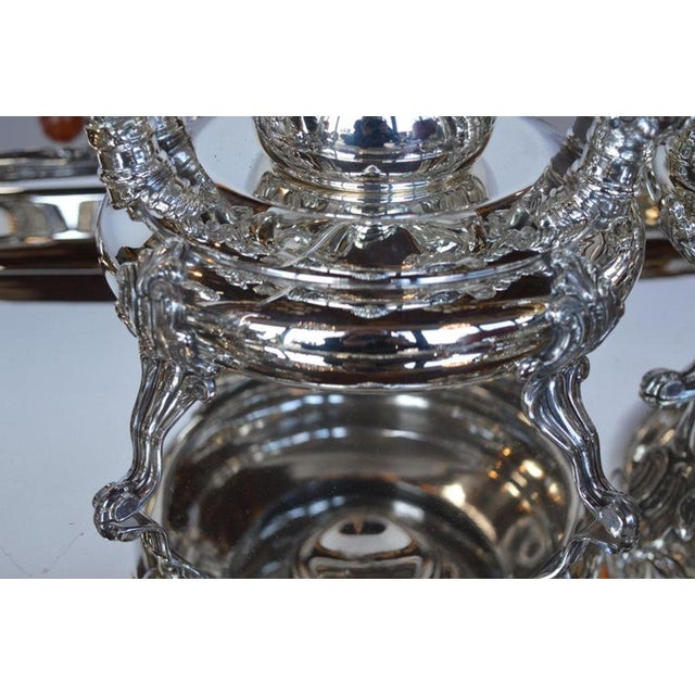 An impressive 19th-century Peruvian sterling silver tea and coffee service, finely executed with elaborate Rococo-inspired...
