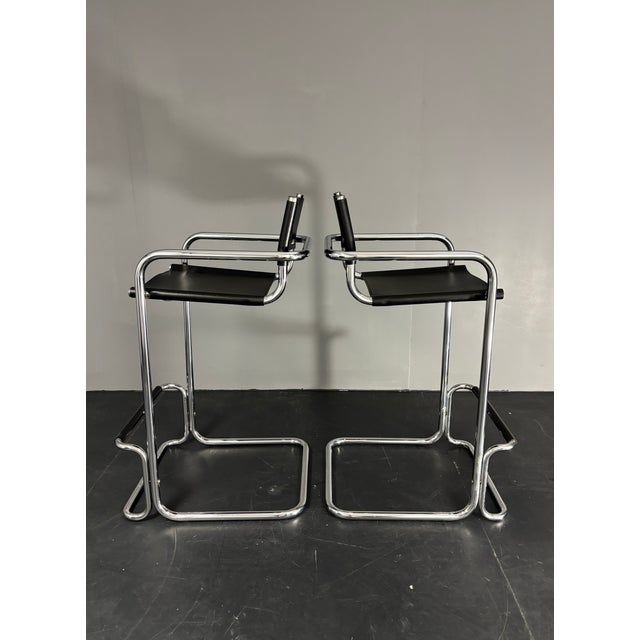 Pair chrome tubular barstools in the style of Mart Stam, Italy 1970s - 1980s. This pair in in great vintage condition with...