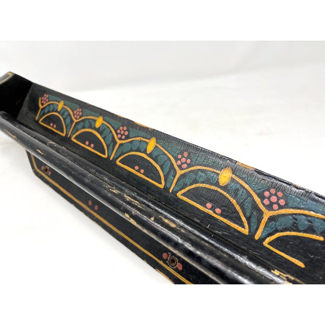 Charming double-rod towel bar that is made of wood and hand-painted in black with a simple swag and flower pattern. Exact...