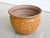 A vintage hand thrown 'thumbprint' planter in golden ochre glaze by famed American ceramicist duo David Cressey and Robert...