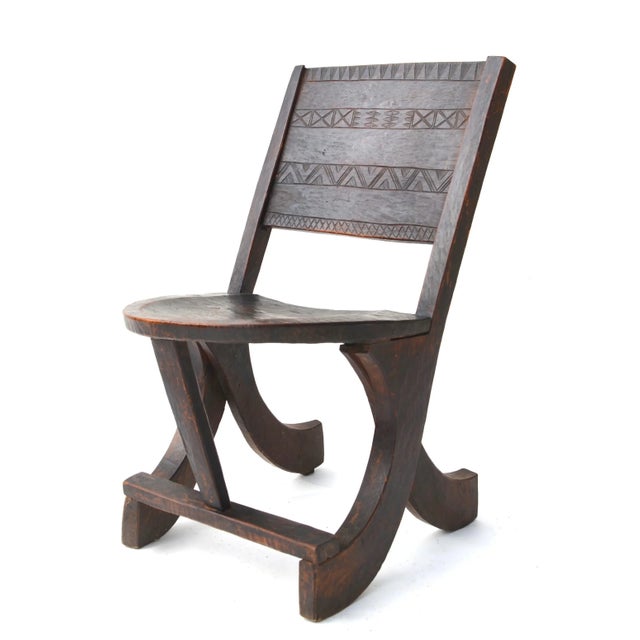 An elegant Ethiopian tribal carved wooden chair with a rich lustrous patina from age and use. Looks like the seat was once...