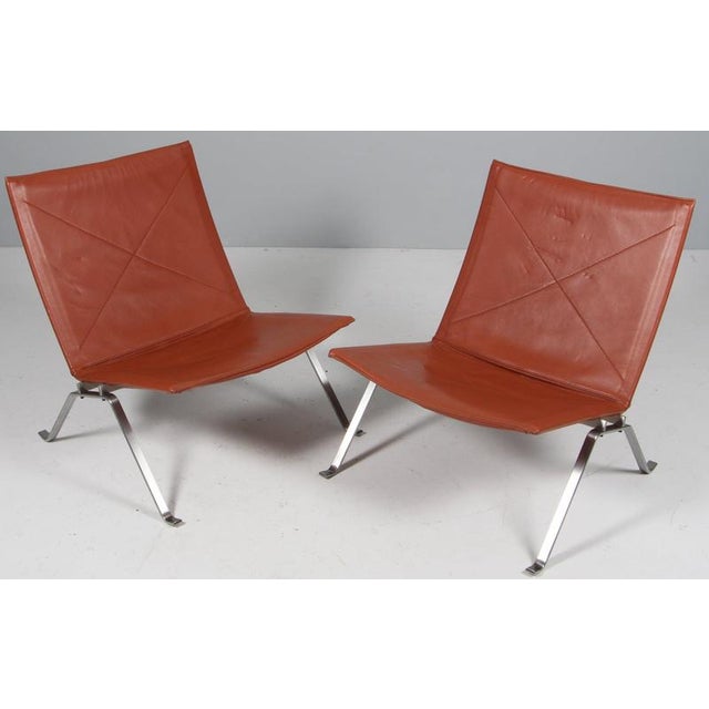 Poul Kjærholm pair of lounge chairs in original patinated tanleather. Frame of brushed steel. Model PK22, made by Fritz...
