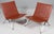 Poul Kjærholm pair of lounge chairs in original patinated tanleather. Frame of brushed steel. Model PK22, made by Fritz...