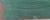 A landscape composed of overlapping areas of green, blue, sienna and earthy tones. The reduced forms suggest vegetation,...