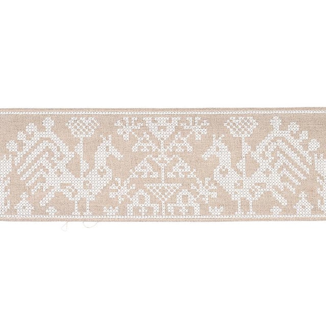 Inspired by the sash on an antique eastern European dress, this tape is charmingly cross-stitched with playful folk art...