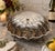 An impressive vintage silverplate buffet server rendered as an oversized scallop shell. The sculptural hinged form opens...
