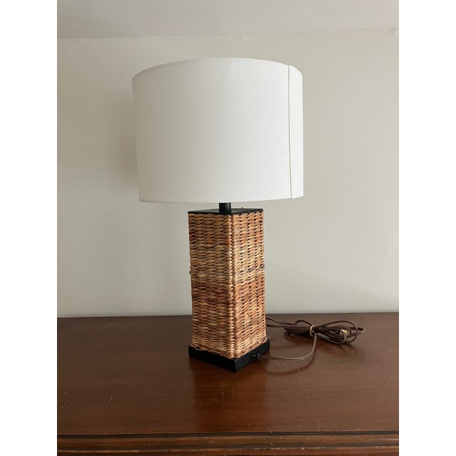 Great condition. Metal and rattan woven smaller table lamp. Perfect for a Pottery Barn, California or beach aesthetic....