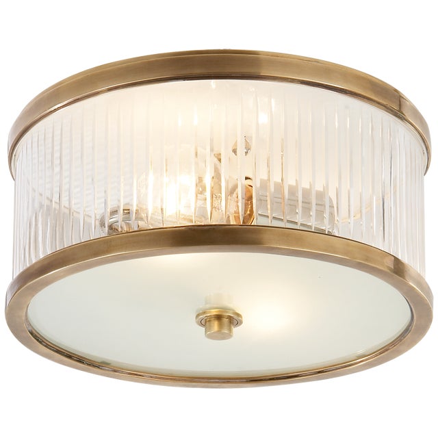 Randolph Small Flush Mount in Hand-Rubbed Antique Brass Designer: Alexa Hampton Mounting: Flush Shade Detail: Frosted...
