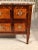 This unique Louis XVI Chest of drawers dates back to around 1780. The two drawer commode stands on slender legs and has a...