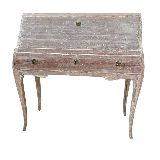 This elegant Swedish Gustavian desk features the neoclassical lines and restrained ornamentation characteristic of the...