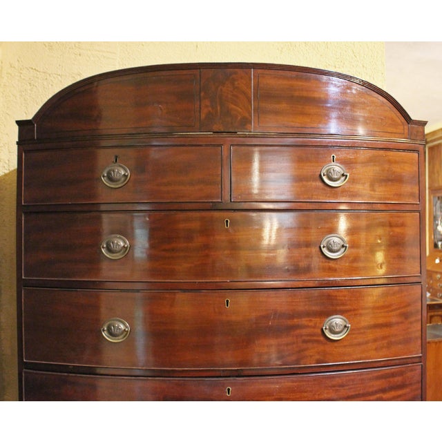 Circa 1800 Georgian bowfront chest on chest, English. Mahogany with rich mahogany veneers. Raised on tall French splay...