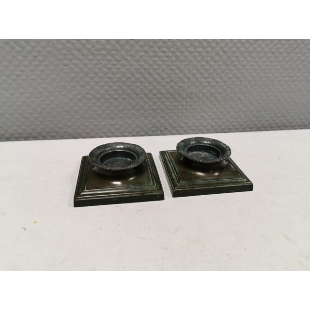 A rare set of Just Andersen Disko-Metal candlesticks (For tealights) 3.5 cm in height, 8.5 x 8.5 cm in length/width and...