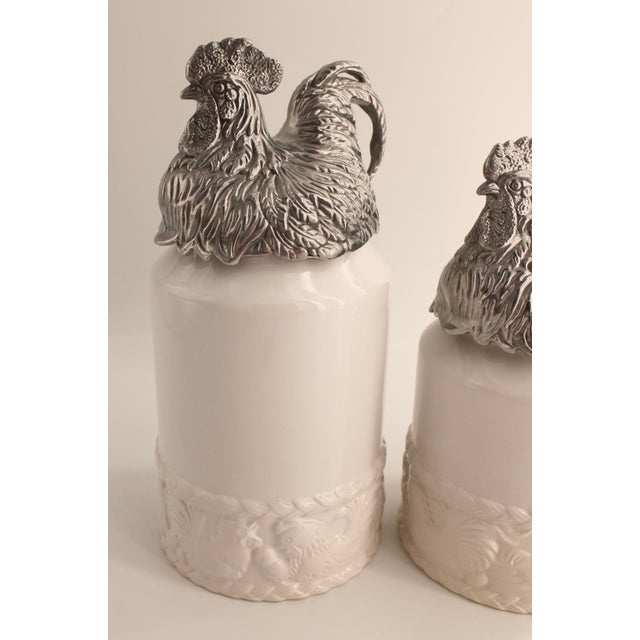 Pair of Arthur Court White Ceramic Canisters with Rooster Lids, 12” & 10.5” Excellent used condition with absolutely no...