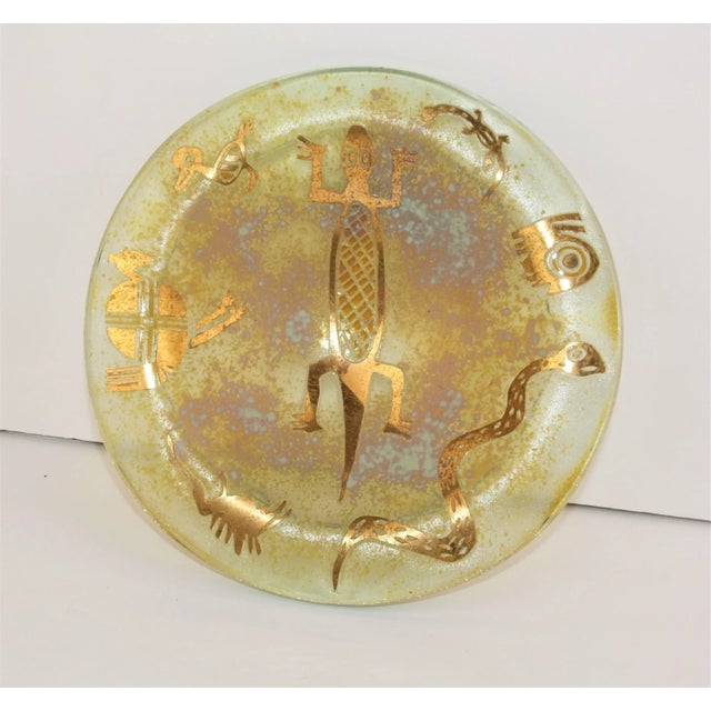 An art inlay glass bowl by famed artist Jorge Bencomo. Heavy glass inlayed with gold leaf metal in figures, Southwest...