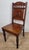 This charming 19th Century kitchen chair shows beautifully handcrafted, intricate carved details from the Victorian Era....