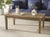 Enhance your outdoor space with the Martinique wood patio coffee table in its natural finish. Crafted from wood, this...