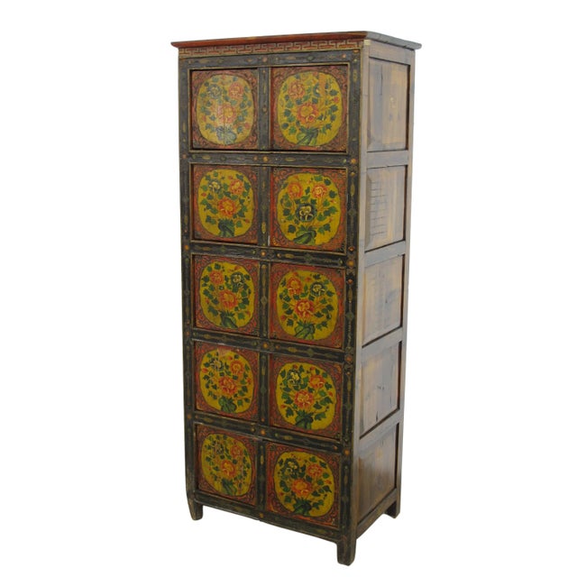 This vintage Tibetan chest is colorfully decorated with exuberant flowers to represent the exotic Tibetan culture and its...