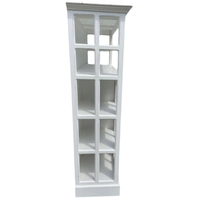 This shabby chic Modern Farmhouse bookcase, in a Cape Cod style, features a tall glass door, two drawers, and open...