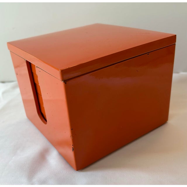 Mid-century orange lacquerware coaster set with a high shine box, lid and six square coasters. A great bar accessory. Made...
