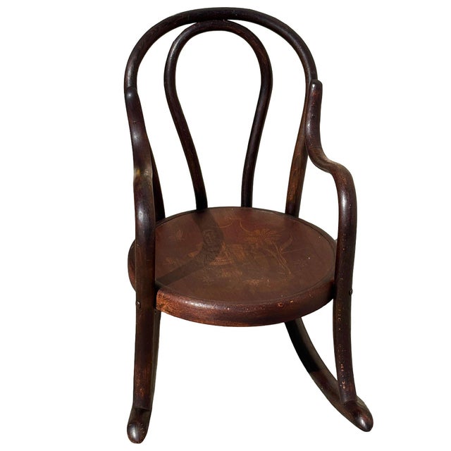 This rare late 19th-century bentwood children's rocking chair, crafted by Fischel in Czechoslovakia, Retaining its...