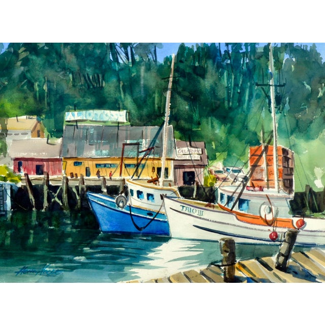 Beautiful watercolor landscape of boats along the wharf by Henry Hank Volle (American, 20th Century). Presented in a...