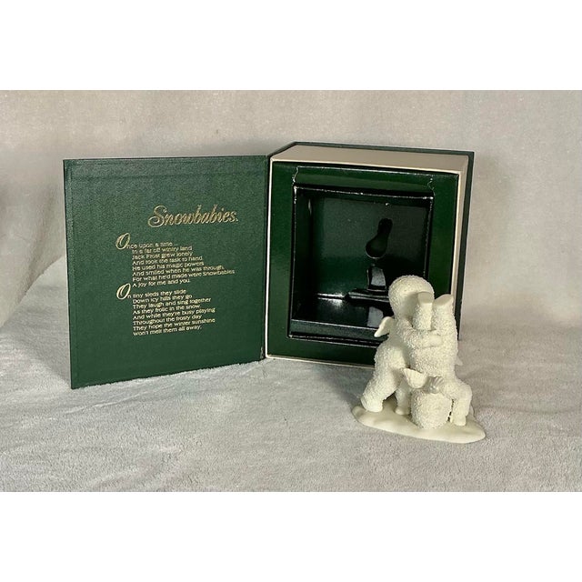 This is a charming collectible Department 56 Snowbabies #68812, titled "Which Way's Up?" (from the Winter Tales of...