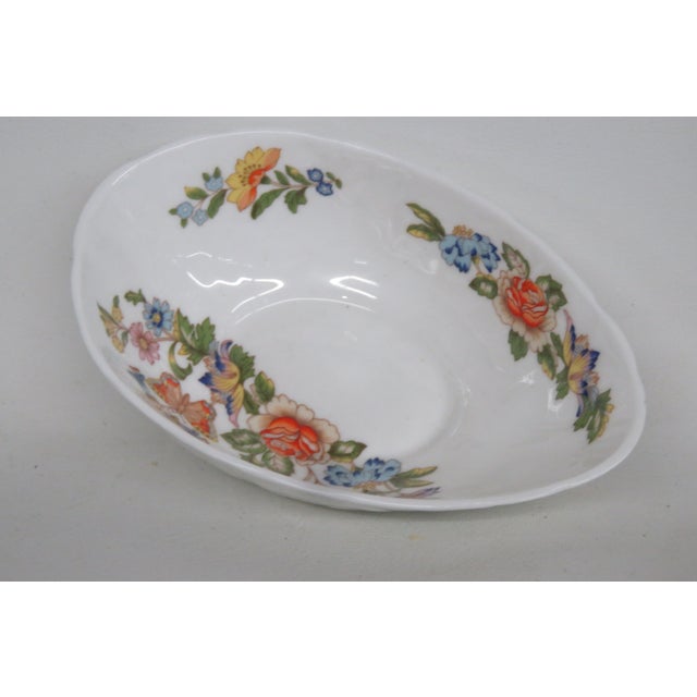 This beautiful bowl is made of Bone China. This piece is stamped by Aynsley in England, Cottage Garden line. This bowl is...