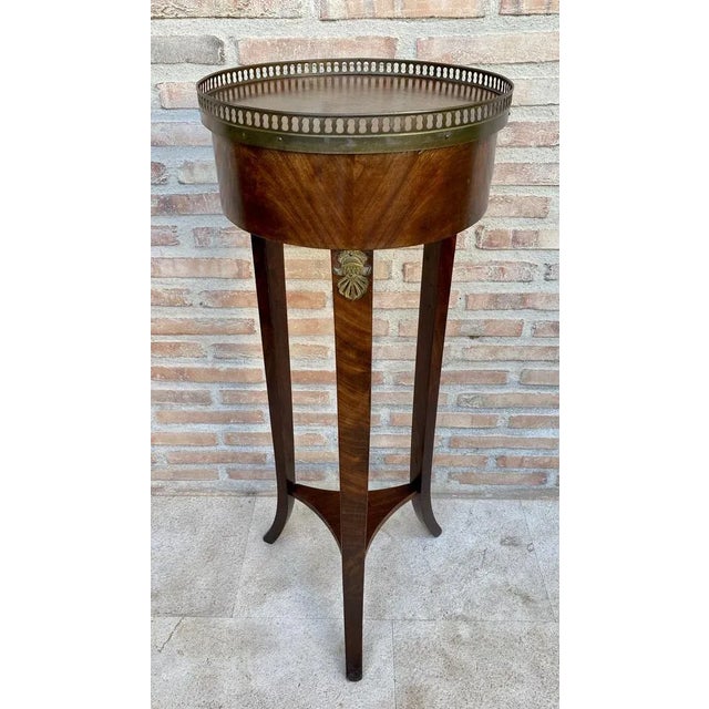 French Louis XVI style walnut Bouillotte table from the 19th century. Antique French Louis XVI style walnut Bouillotte...