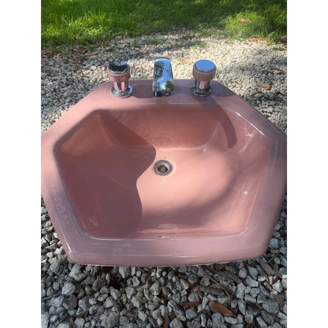 A rare and highly distinctive Kohler K-2930 Hexsign / Hexagon lavatory sink in the iconic Wild Rose pink finish,...