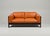 A two-seater sofa designed by Tobia Scarpa for Gavina, the rosewood frame holds cognac-colored leather cushions. The frame...