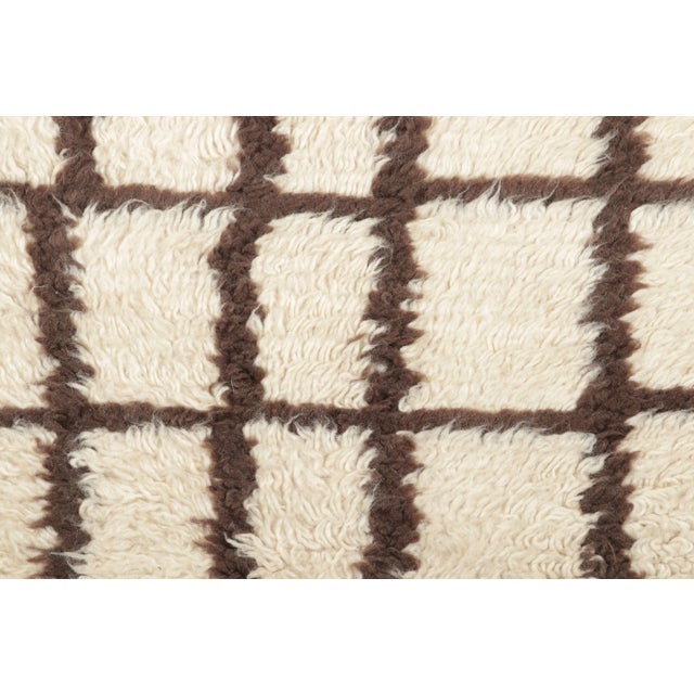 Hand-knotted in wool, this 2x3 contemporary Moroccan-style shag rug brings the sculptural warmth of Berber weaving into an...